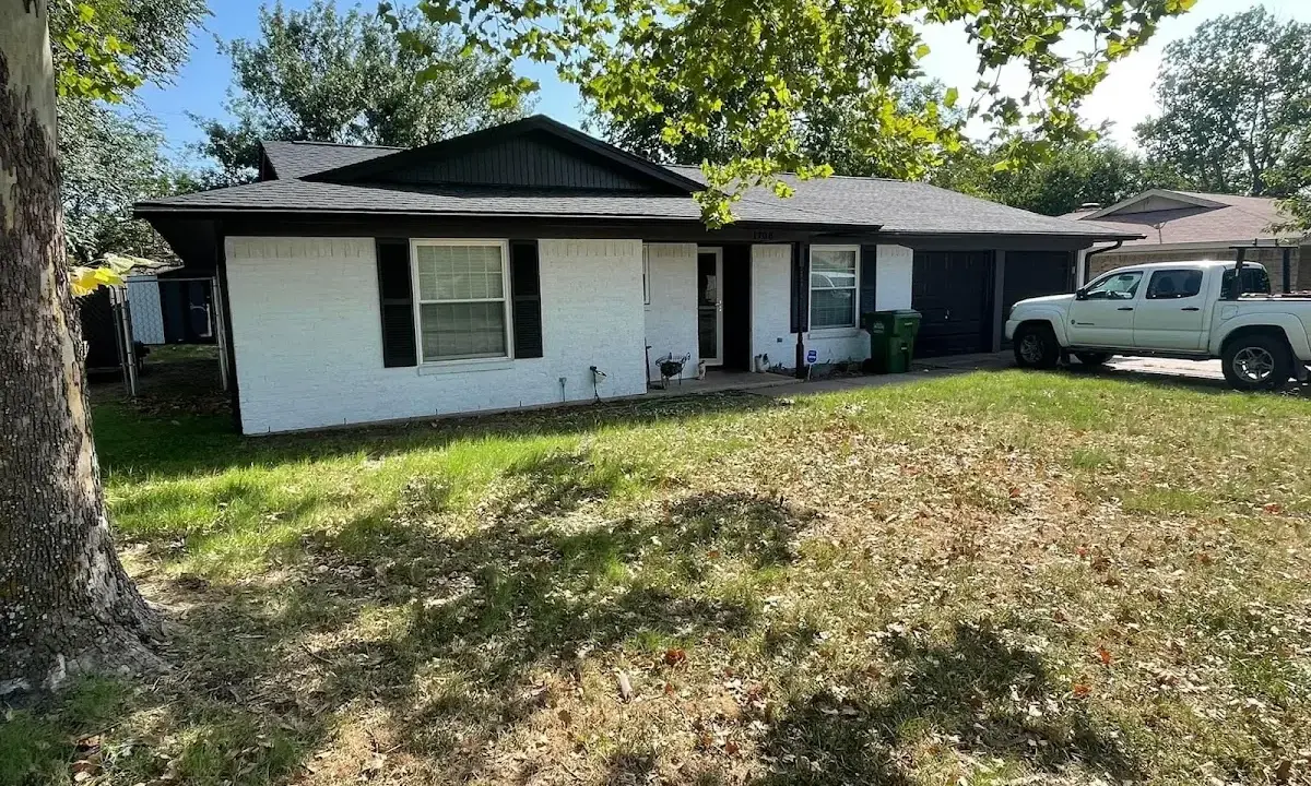 Professional roofing crew working on a residential roof in Wyandotte